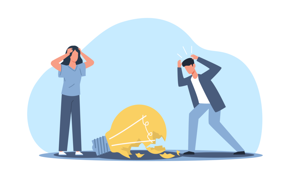 割れた豆電球と頭を抱える男女